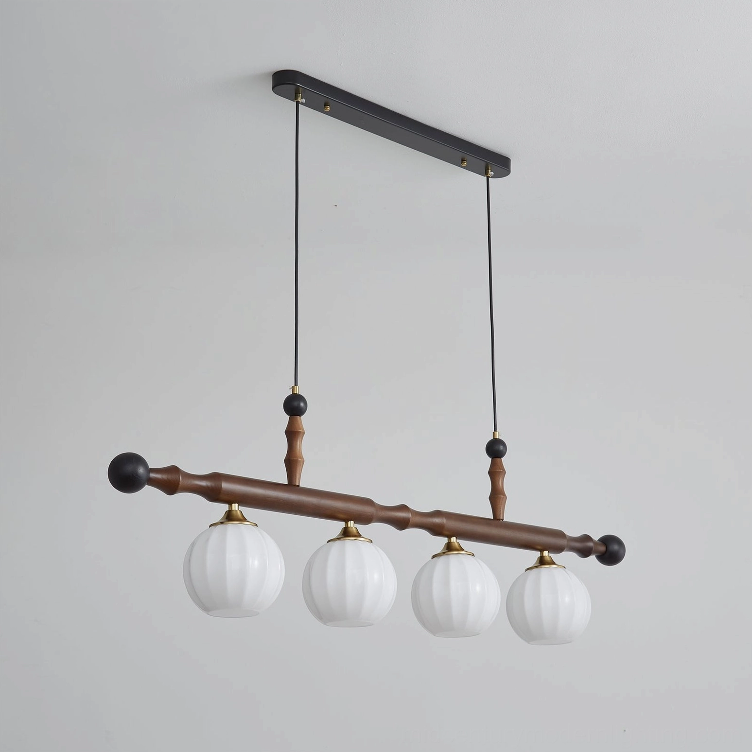 Elisha mid-century modern walnut chandelier showing interior ribbed texture of frosted glass shades