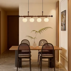 Elisha mid-century modern pendant chandelier suspended above dining table in warm traditional dining room setting