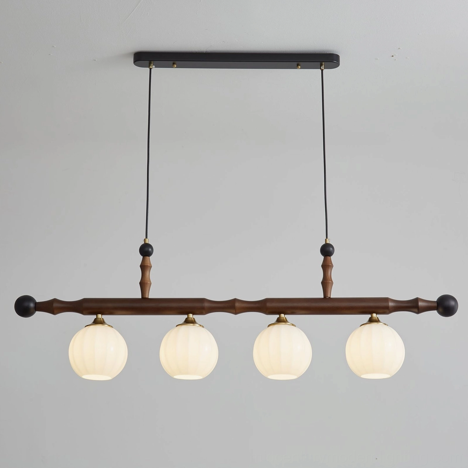 Elisha walnut wood mid-century modern chandelier with brushed gold accents - detail view of craftsmanship