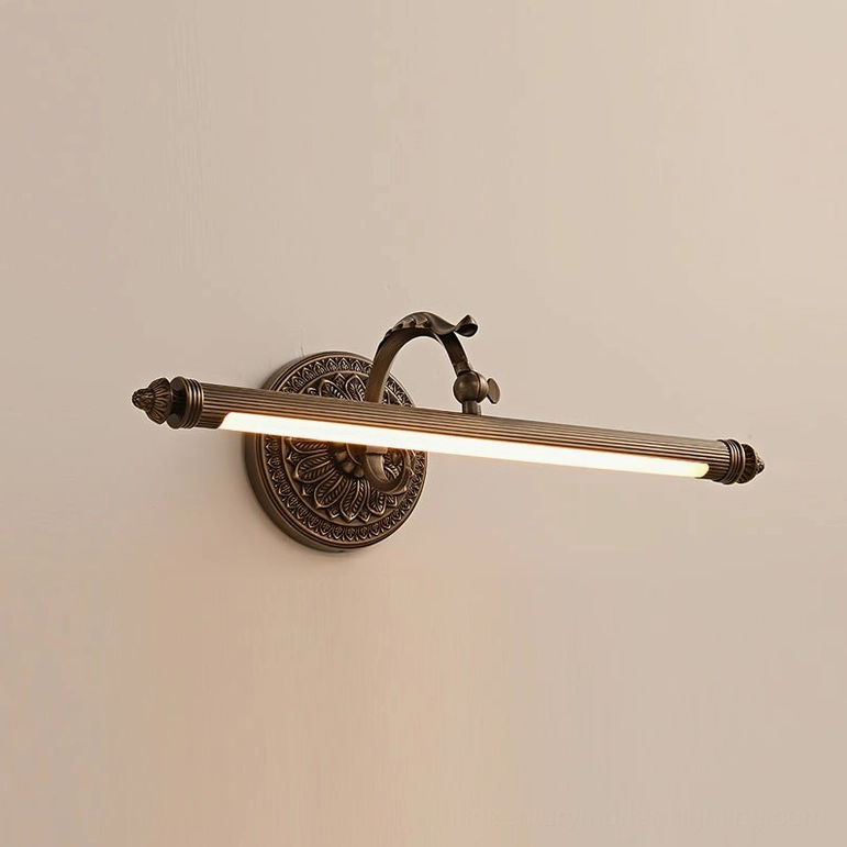 Ellesmere compact brass wall sconce in antique finish showing detailed arm and backplate construction
