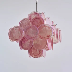 Pink Murano disc chandelier close-up showing clustered round glass discs with polished metal suspension rod and connection hardware