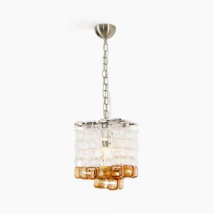Elodie Murano glass chandelier with clear and amber glass blocks in cube formation, studio front view with silver metal hardware and adjustable chain