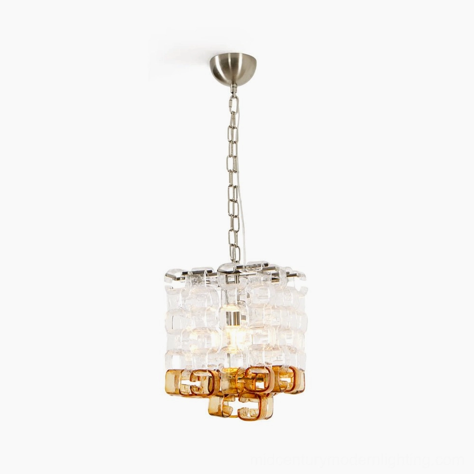Elodie Murano glass chandelier with clear and amber glass blocks in cube formation, studio front view with silver metal hardware and adjustable chain