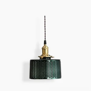 Emerald green glass pendant lamp with chevron texture and brass fixture, front view studio display