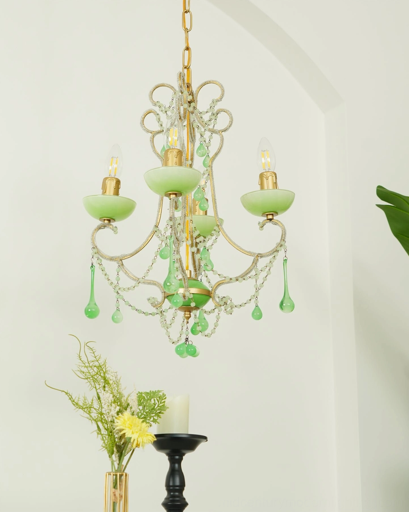Emerald Murano glass chandelier detail showing intricately crafted glass beads and metal suspension system