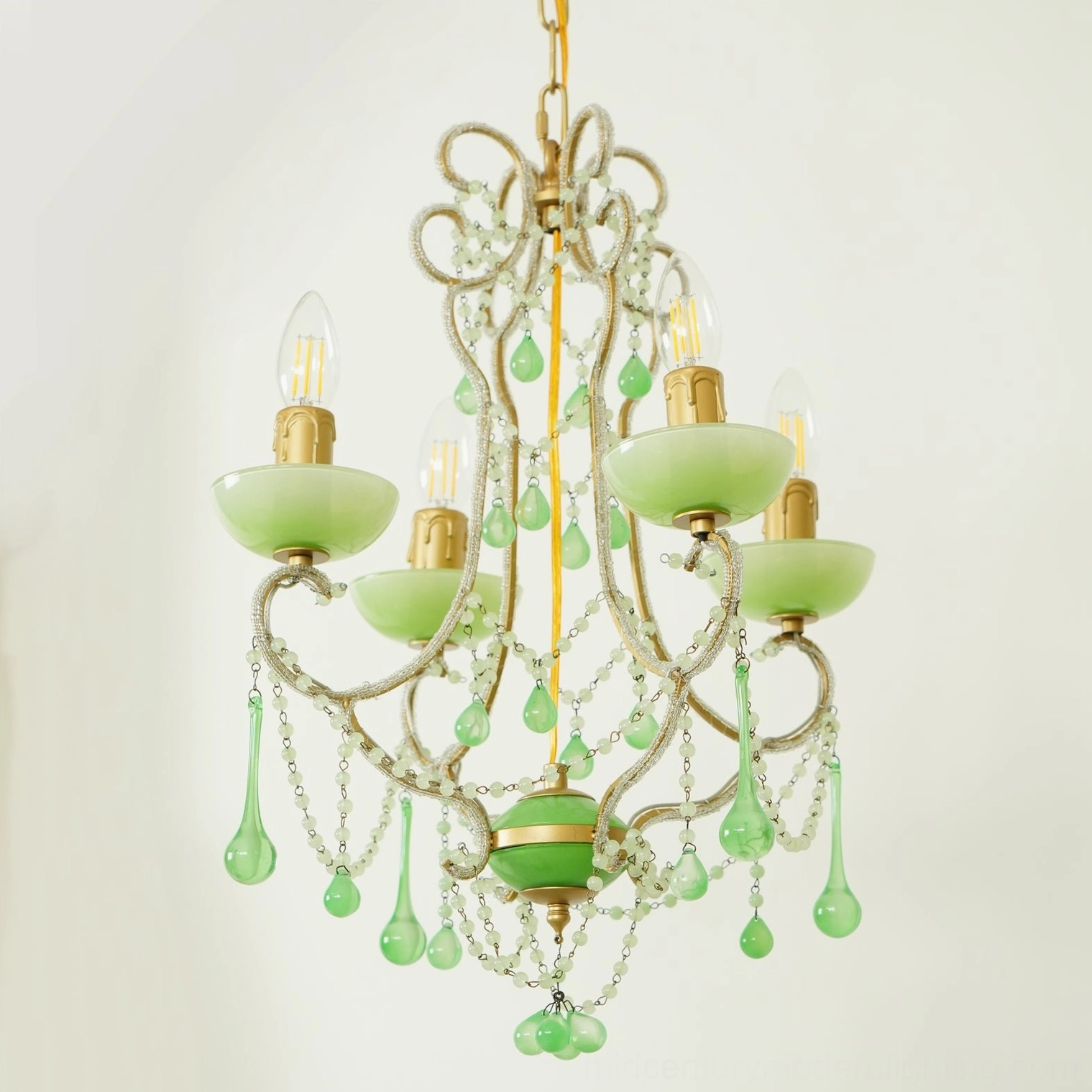Artisanal emerald green Murano chandelier featuring hand-blown glass drops and vintage gold finish