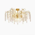 Emily Branch crystal chandelier front view with lit candle bulbs, showing brass frame and cascading crystal drops