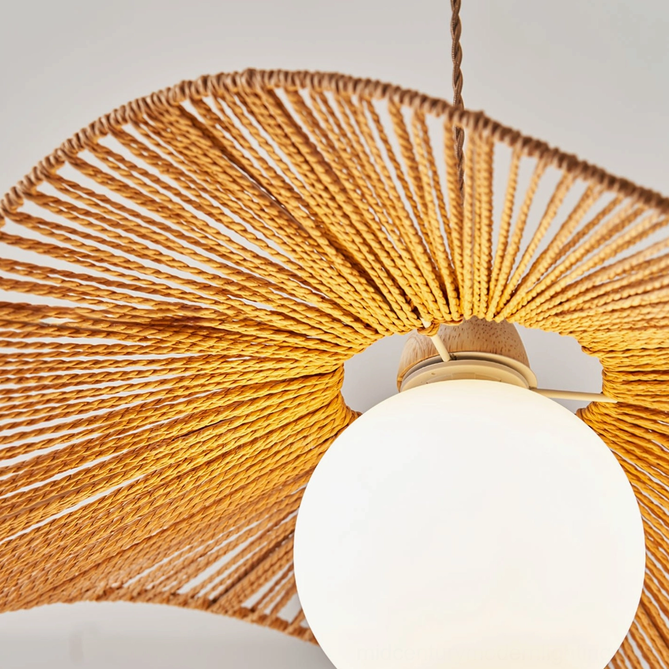Close-up overhead view of Emmi rope pendant lamp shade showing detailed woven hemp rope texture with exposed globe bulb