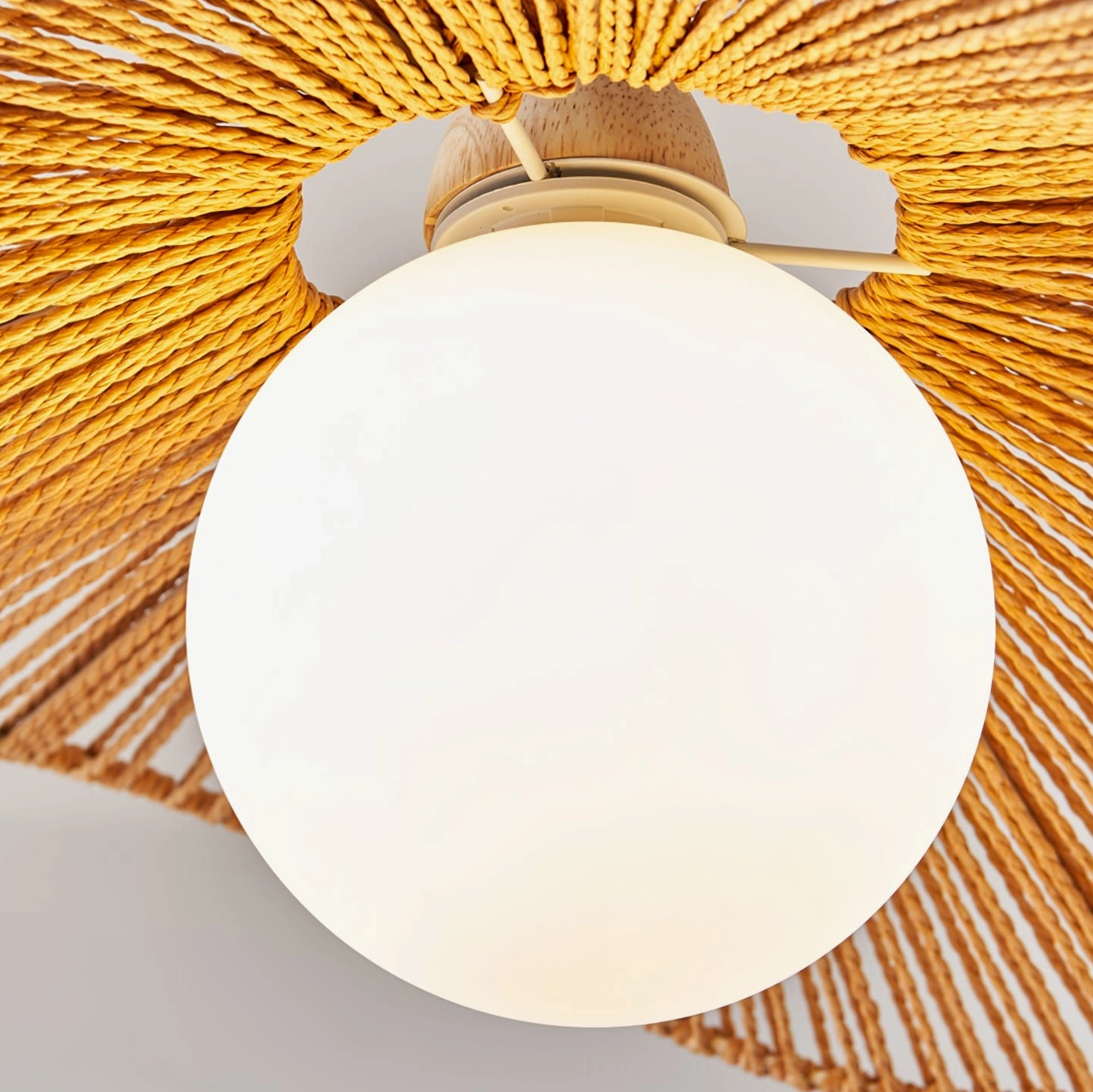 Emmi handwoven rope pendant lamp with natural hemp shade and wood metal frame in neutral interior setting
