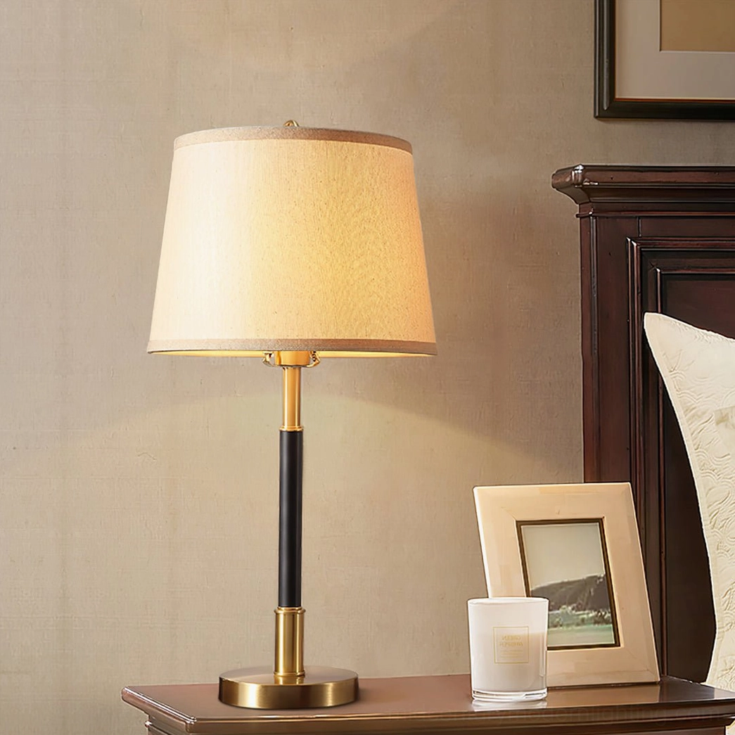 Empire Table Lamp on bedroom bedside table with candle and photo frame on dark wood furniture