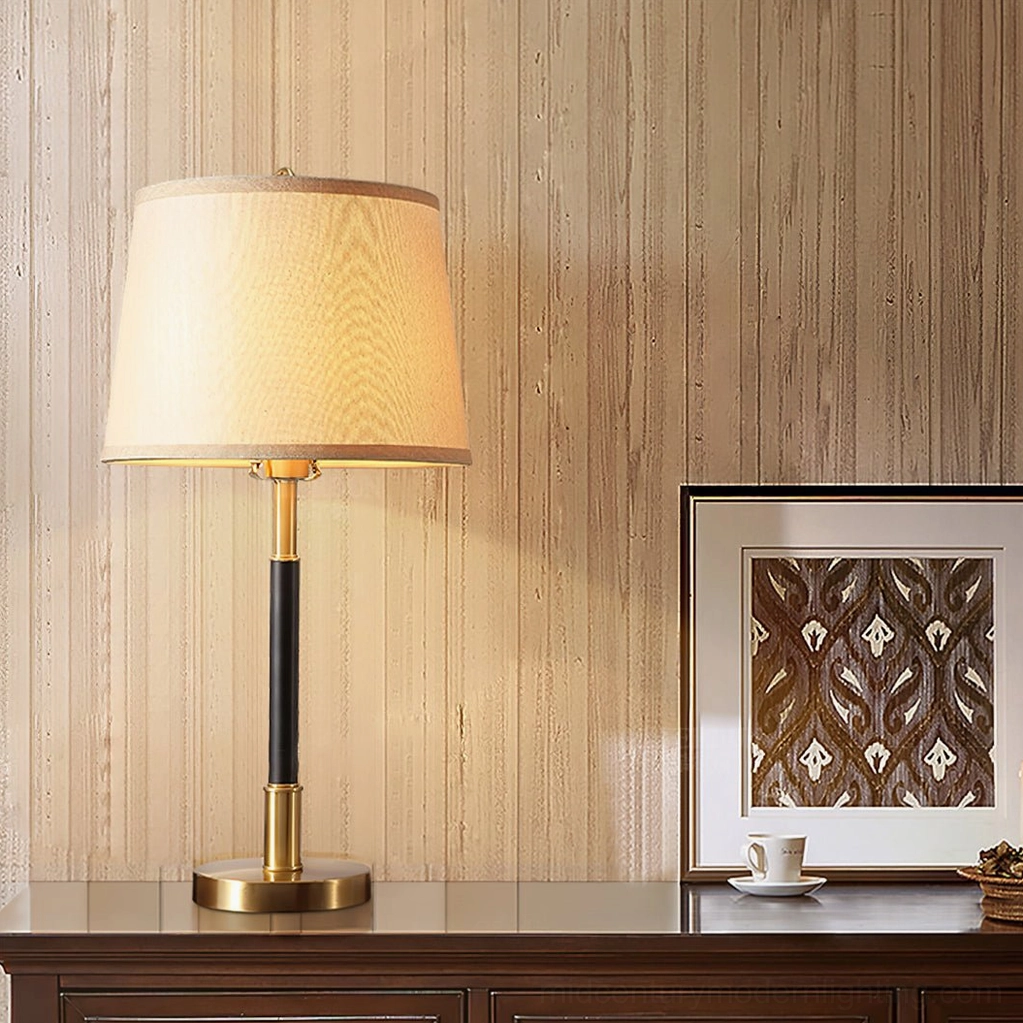 Empire Table Lamp on living room side cabinet with wall art decor in brass-black-beige color scheme