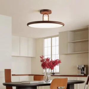 Walnut Envostar ceiling lamp installed in modern open-plan dining kitchen space with natural warm lighting