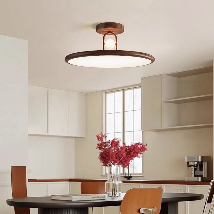 Walnut Envostar ceiling lamp installed in modern open-plan dining kitchen space with natural warm lighting