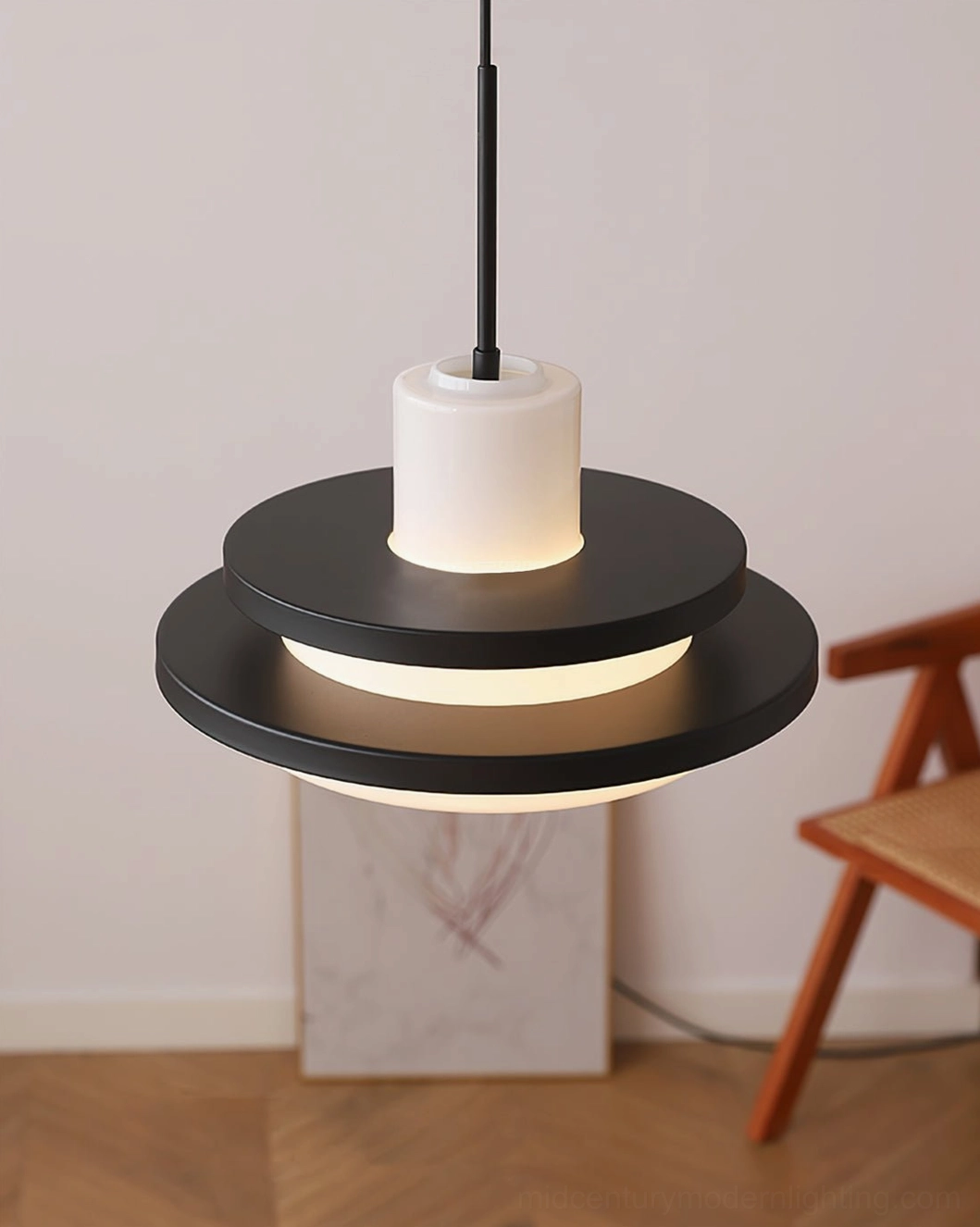 Black and white matte pendant lamp in home living space with wooden floor, sleek contemporary design