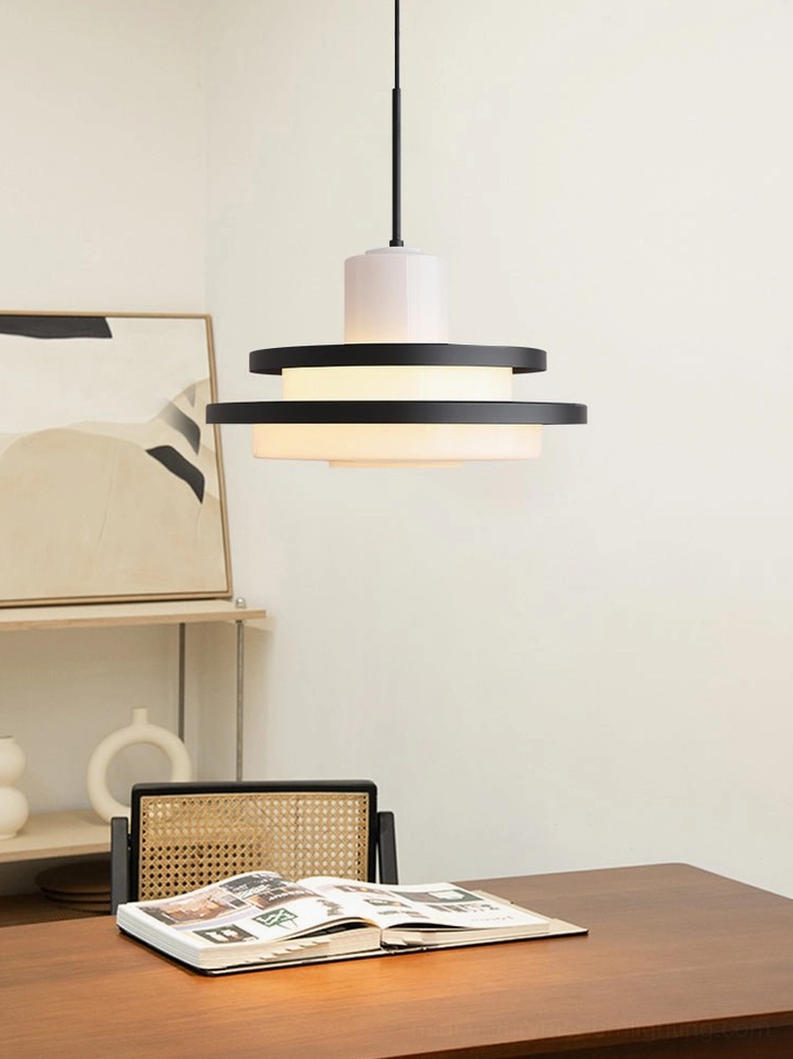 Black and white pendant lamp above wooden dining table, modern dining room lighting fixture
