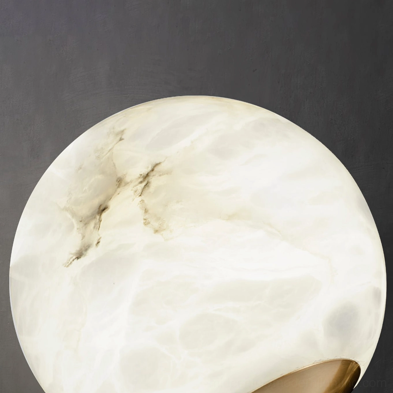 Erich chandelier arm details showing spoked design elements and polished brass material quality