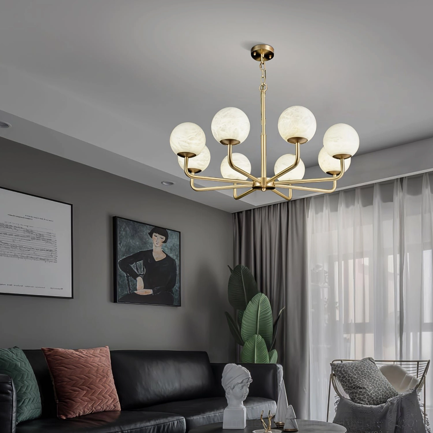 Mid-century modern brass chandelier installed in contemporary formal living room with sophisticated warm lighting