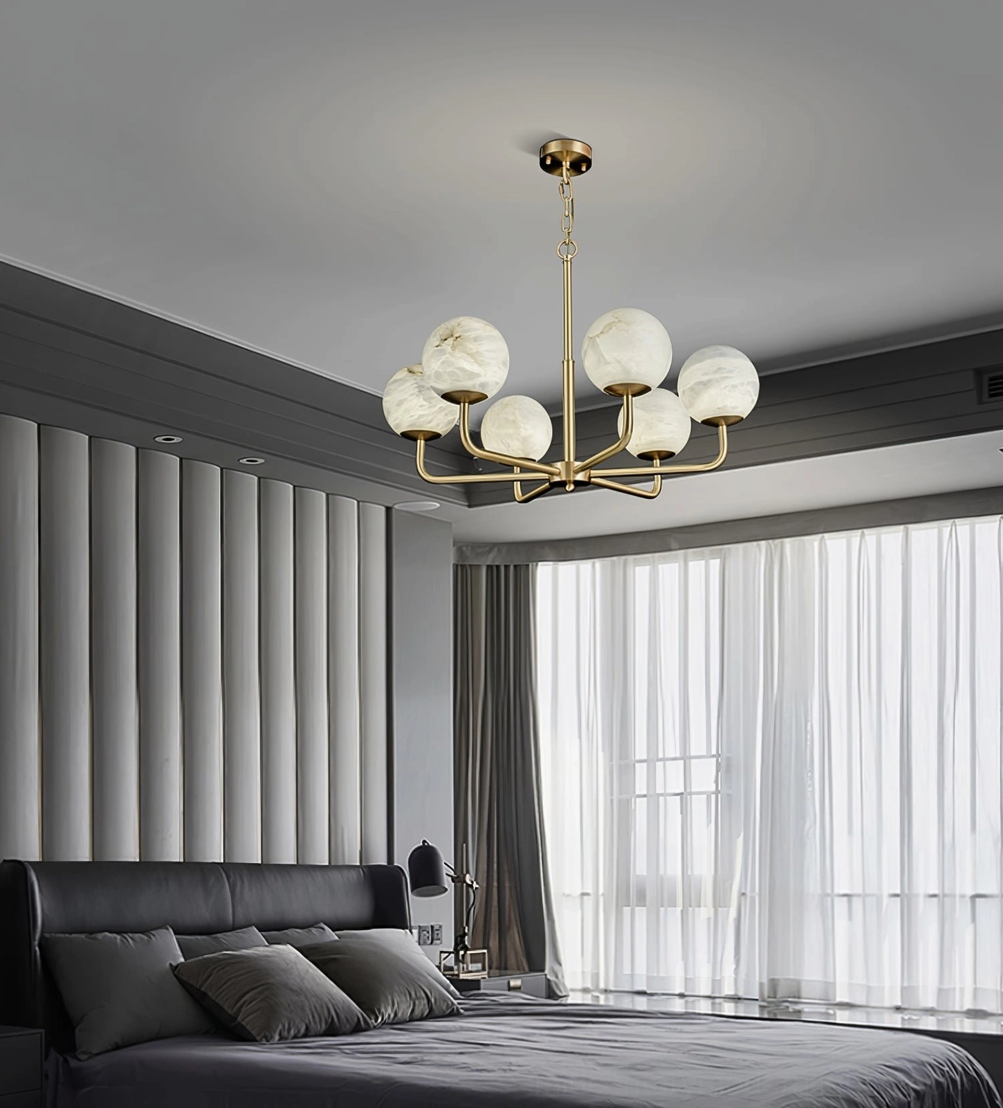 Erich brass chandelier showing individual globe light diffusion and warm ambiance creation capability