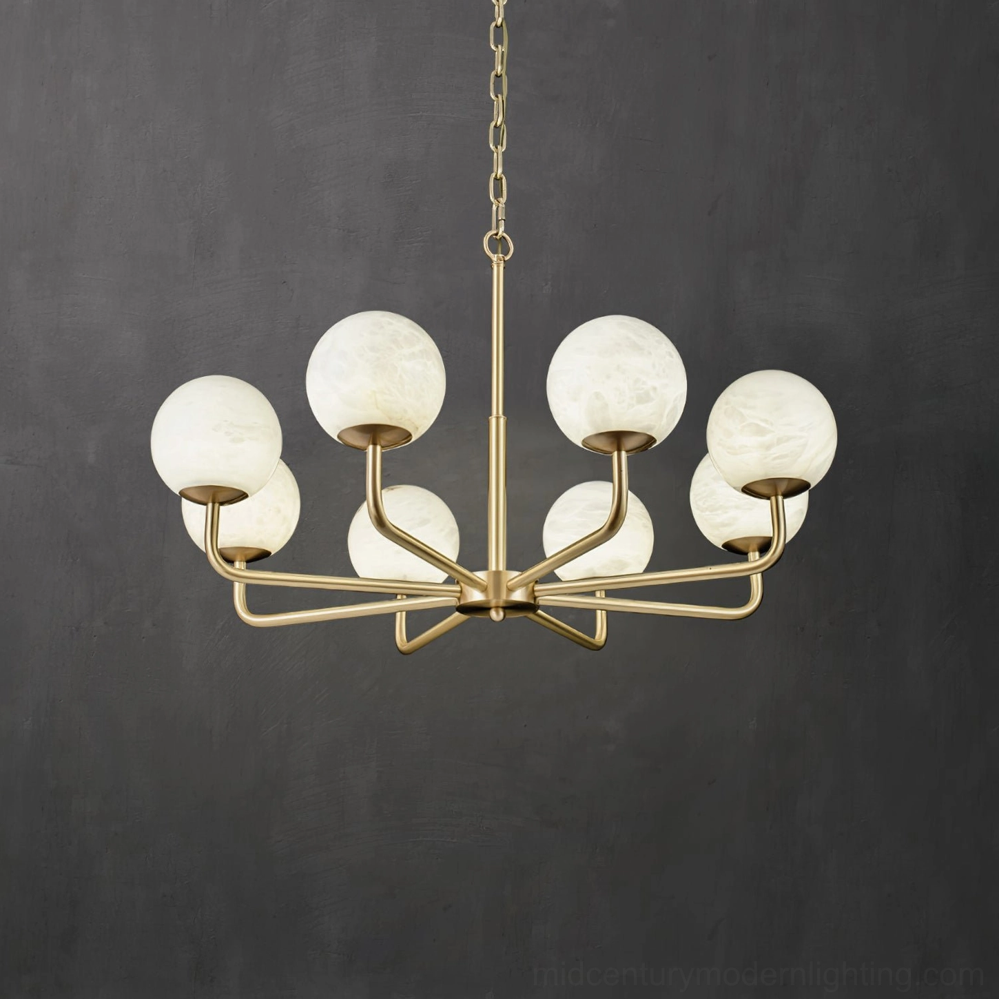 Luxury residential space featuring Erich brass chandelier with multiple glowing alabaster globes as statement lighting