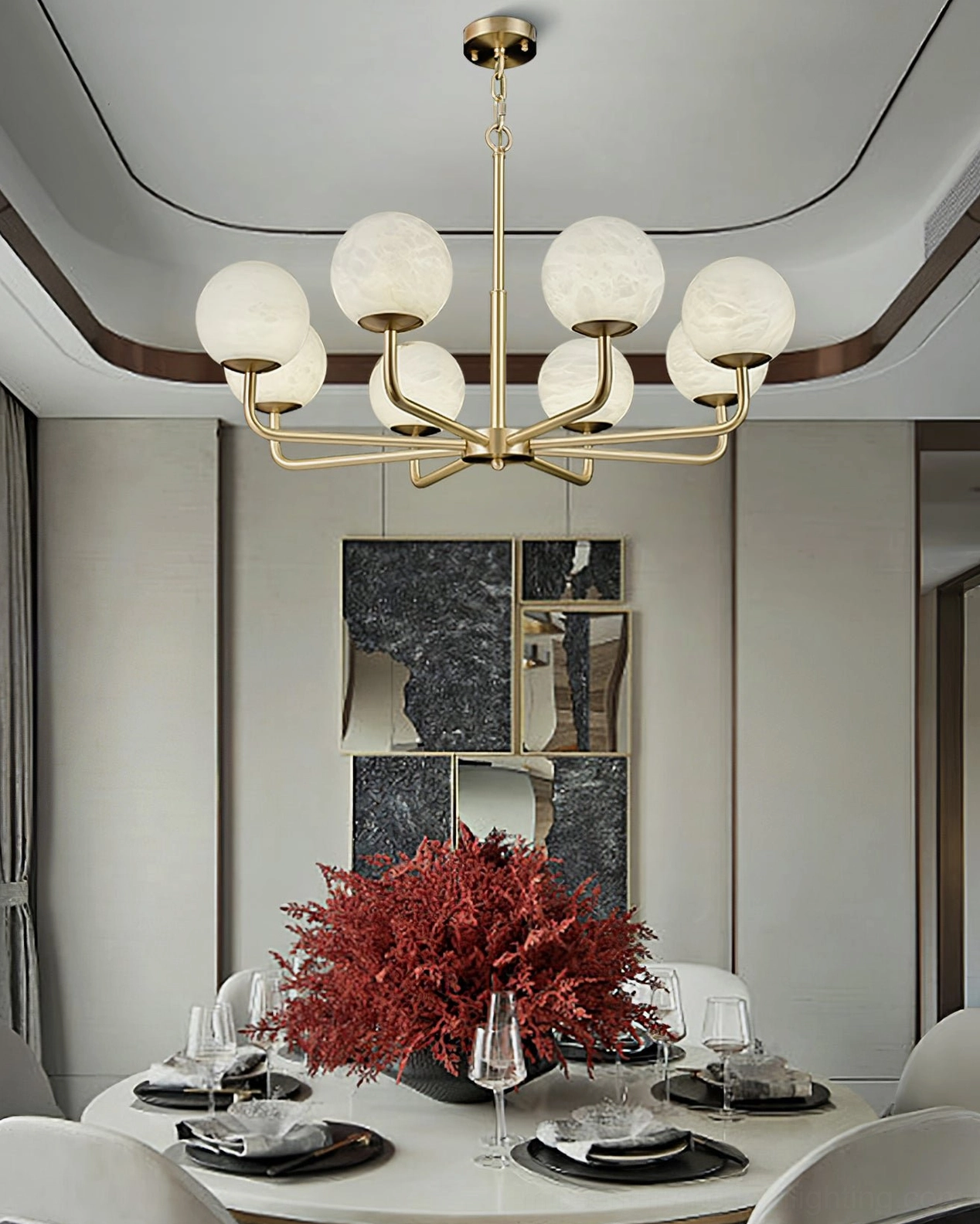 Erich chandelier eight head configuration showing expanded width and polished brass finish in studio lighting