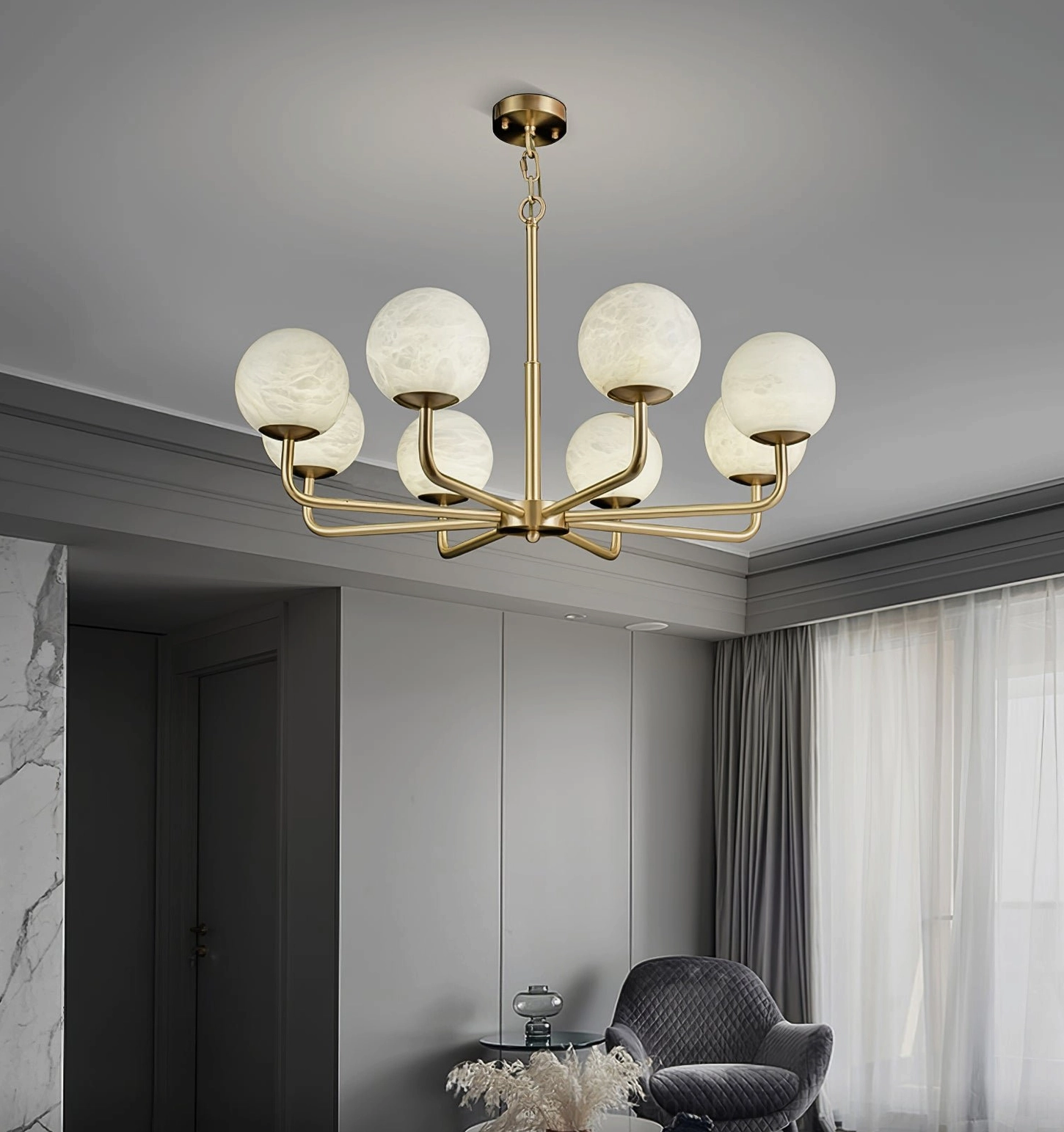 Minimalist modern living room ceiling view of Erich chandelier with eight heads and frosted alabaster shades