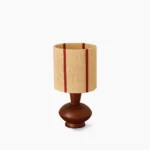 Ernest mid-century modern table lamp front view with striped beige and red linen shade on white background