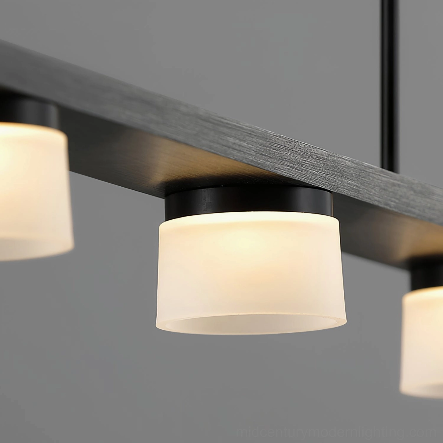Geometric pendant light close-up detail shot black metal frame with frosted acrylic spheres