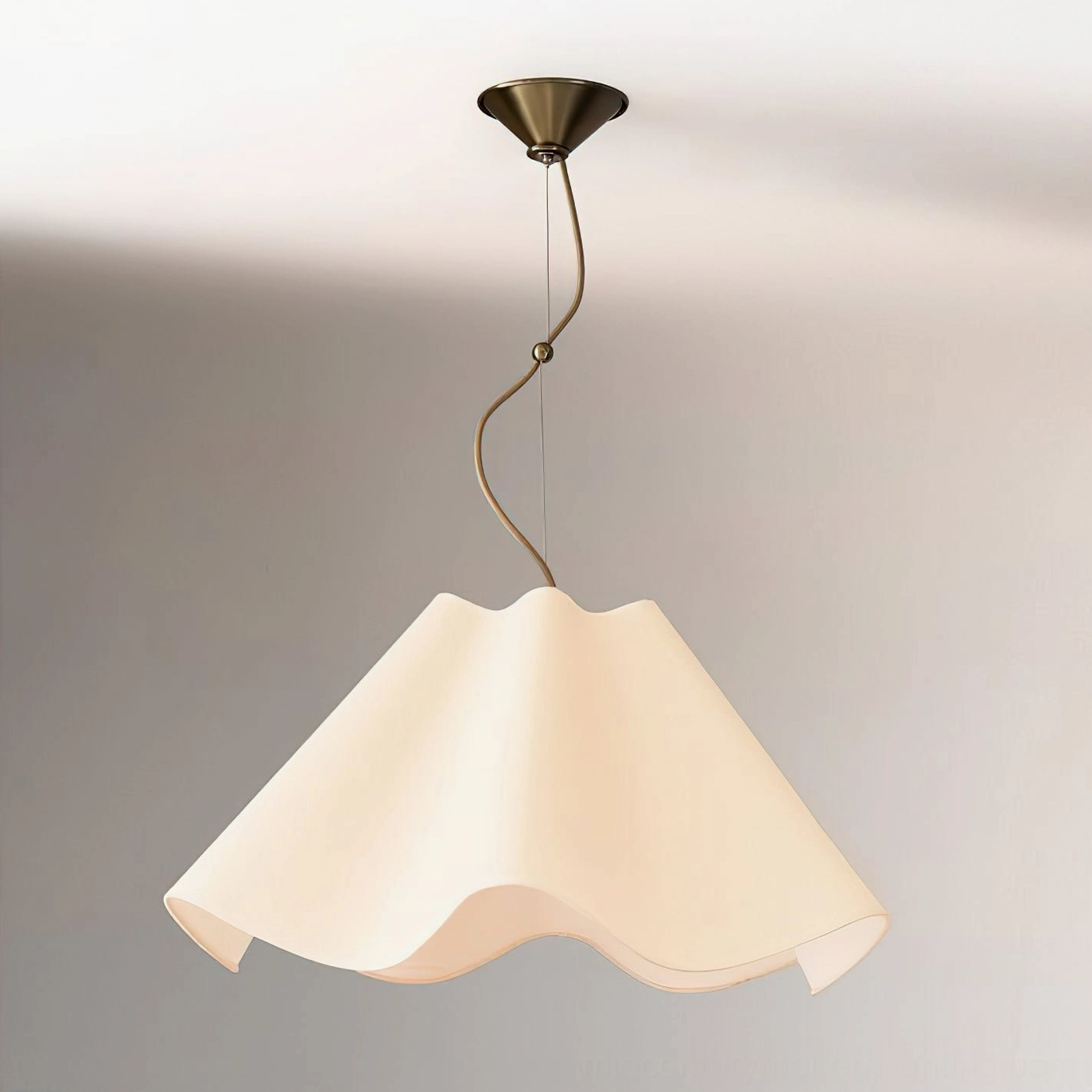 Ethereal Warm-Toned Wavy Pendant Lamp with beige fabric shade and brass hardware, three-quarter front view in studio setting