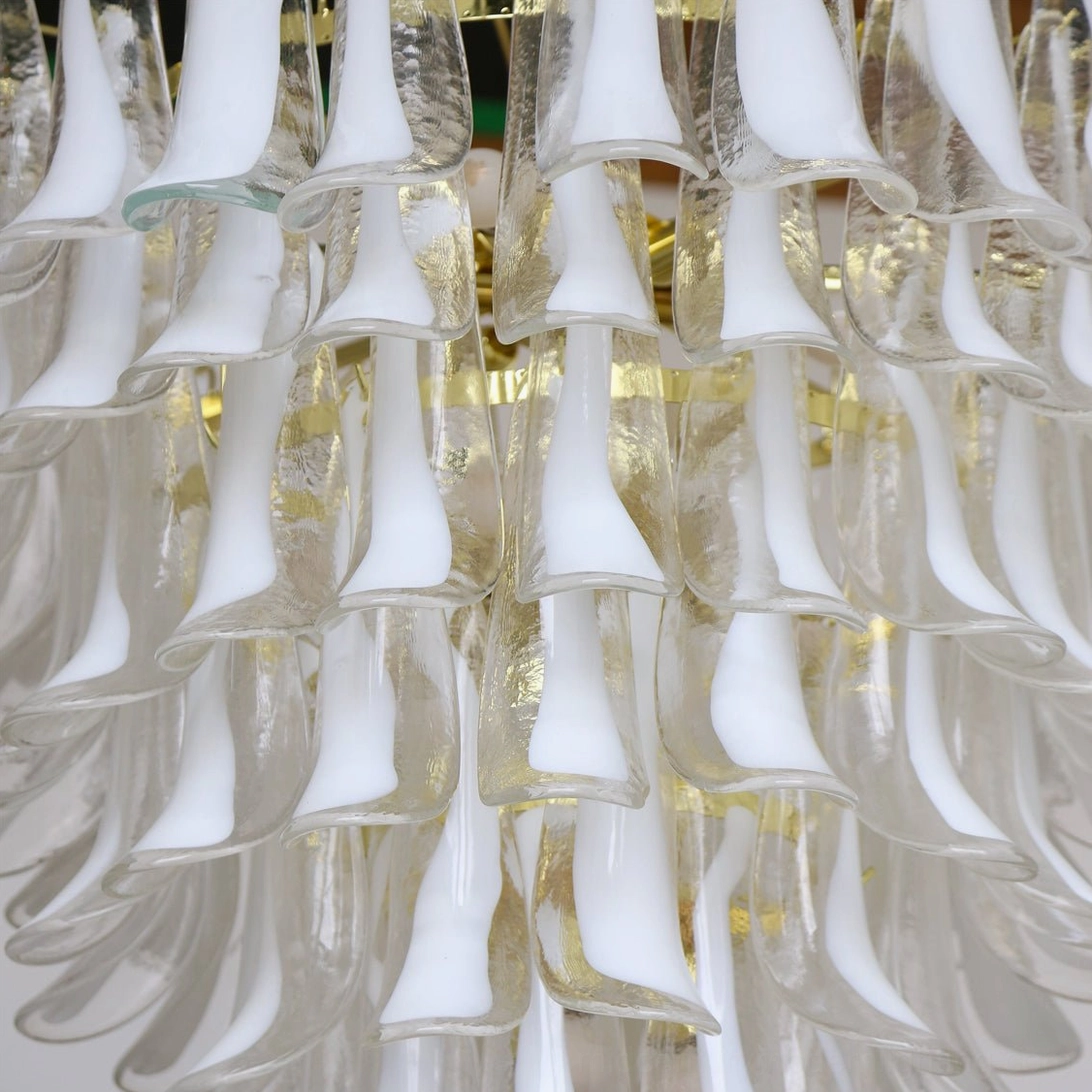 Close-up detail of glass petal construction showing mixed frosted and clear hand-blown petal design and metallic framework