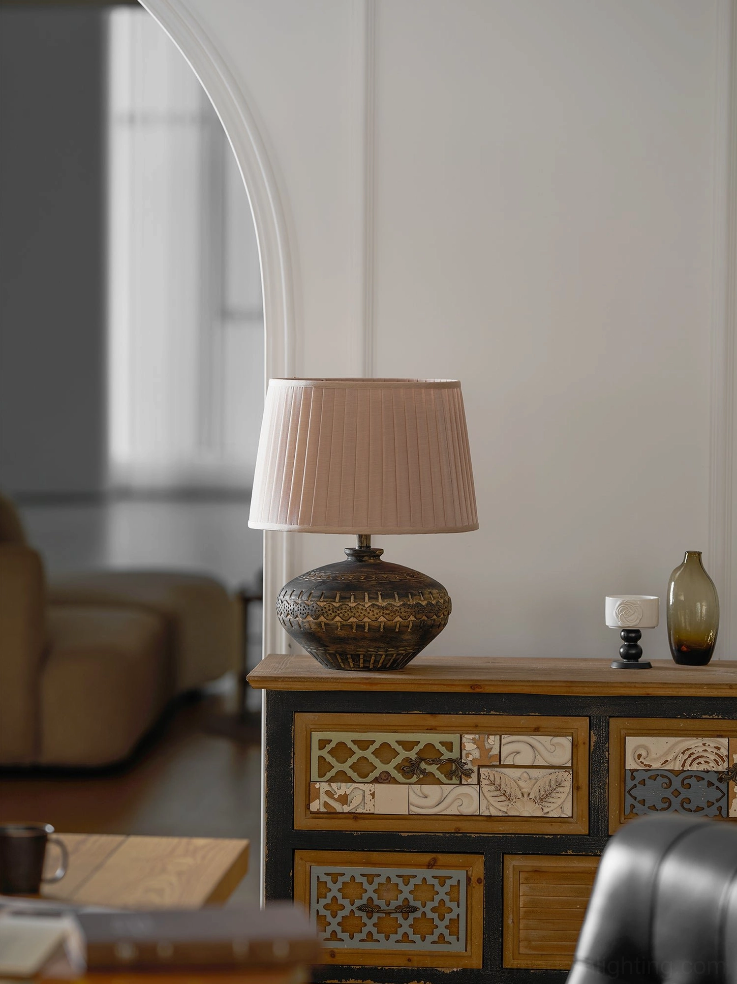 Etta ceramic table lamp detail shot highlighting textured ceramic base and neutral linen shade construction