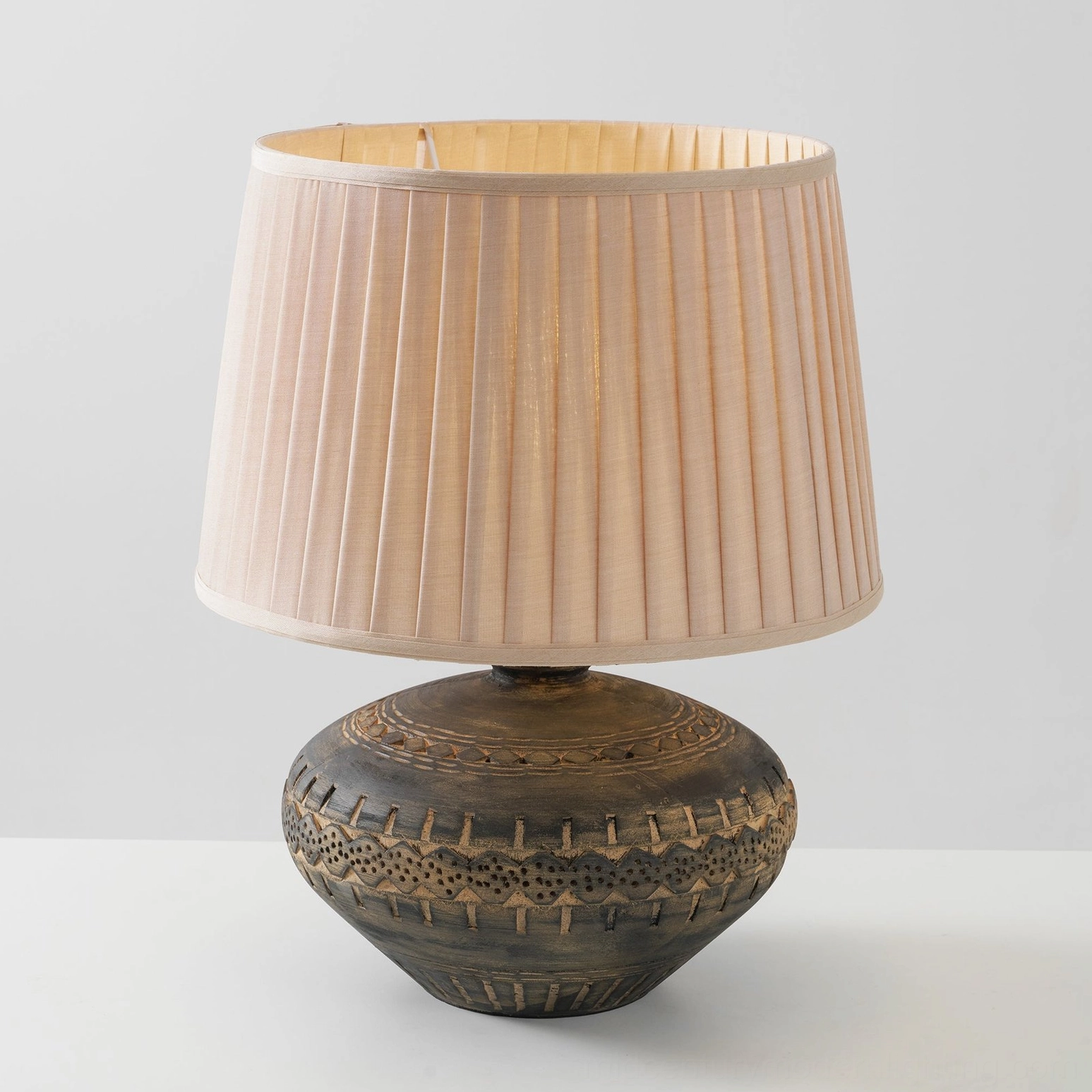 Etta ceramic table lamp positioned as home decor accent piece with warm bohemian aesthetic and vintage charm
