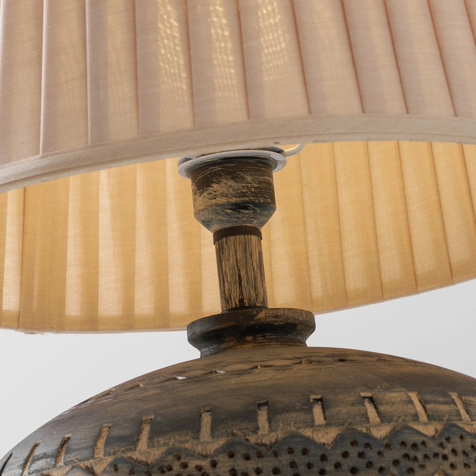 Etta ceramic table lamp styled in interior space demonstrating versatile placement and ambient lighting effect