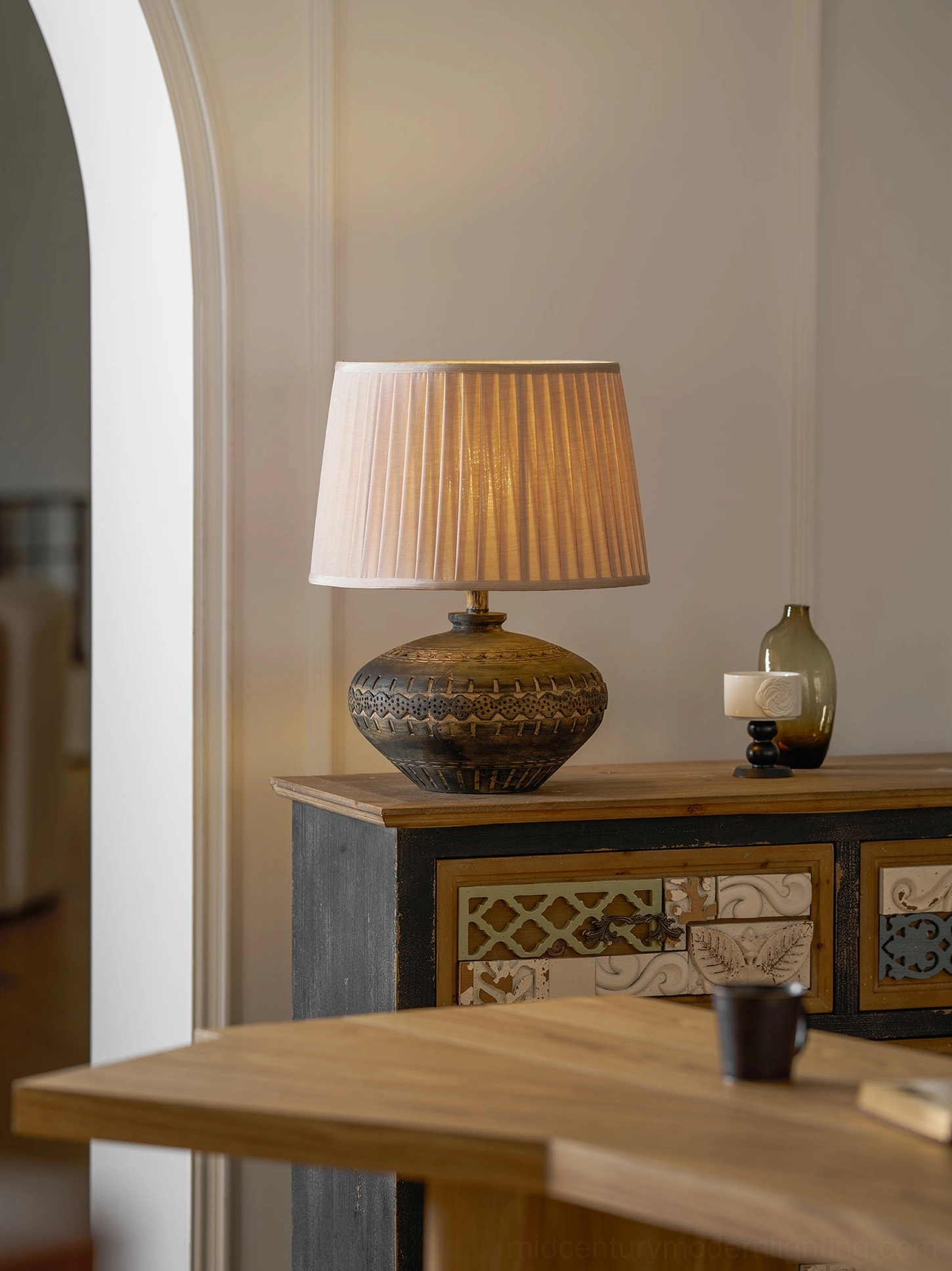 Etta table lamp base detail highlighting marbled ceramic finish and geometric embossed decorative elements
