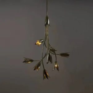 Evadne brass tulip chandelier close-up with warm golden light emission showing bud-shaped shades