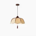 Evelyn mid-century pendant lamp with scalloped fabric shade, overhead view, white studio background