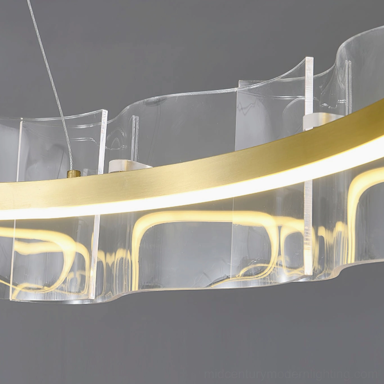 Brushed gold metal light strip detail inside Evette acrylic pendant shade