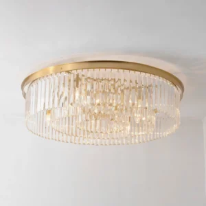 Evina crystal ceiling light illuminated showing sparkling faceted crystal rods with warm brass frame
