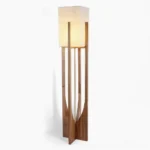 Fairbanks mid-century modern floor lamp with wooden frame and white fabric shade on studio background