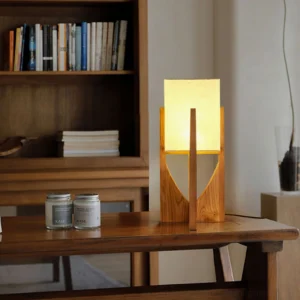 Fairbanks table lamp warm glow wooden bookshelf study room interior design