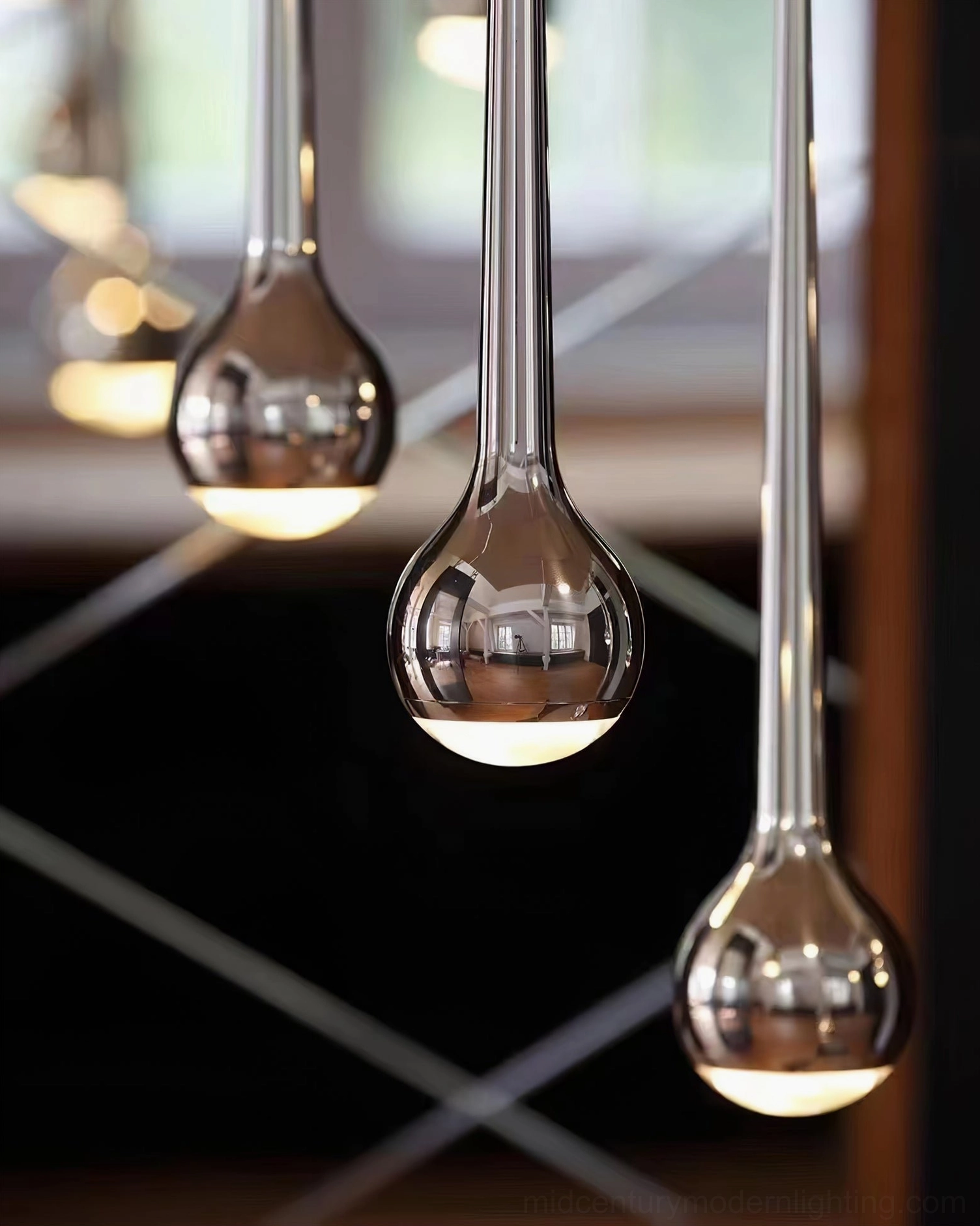 Single matte black pendant light suspended in minimalist modern bedroom accent view