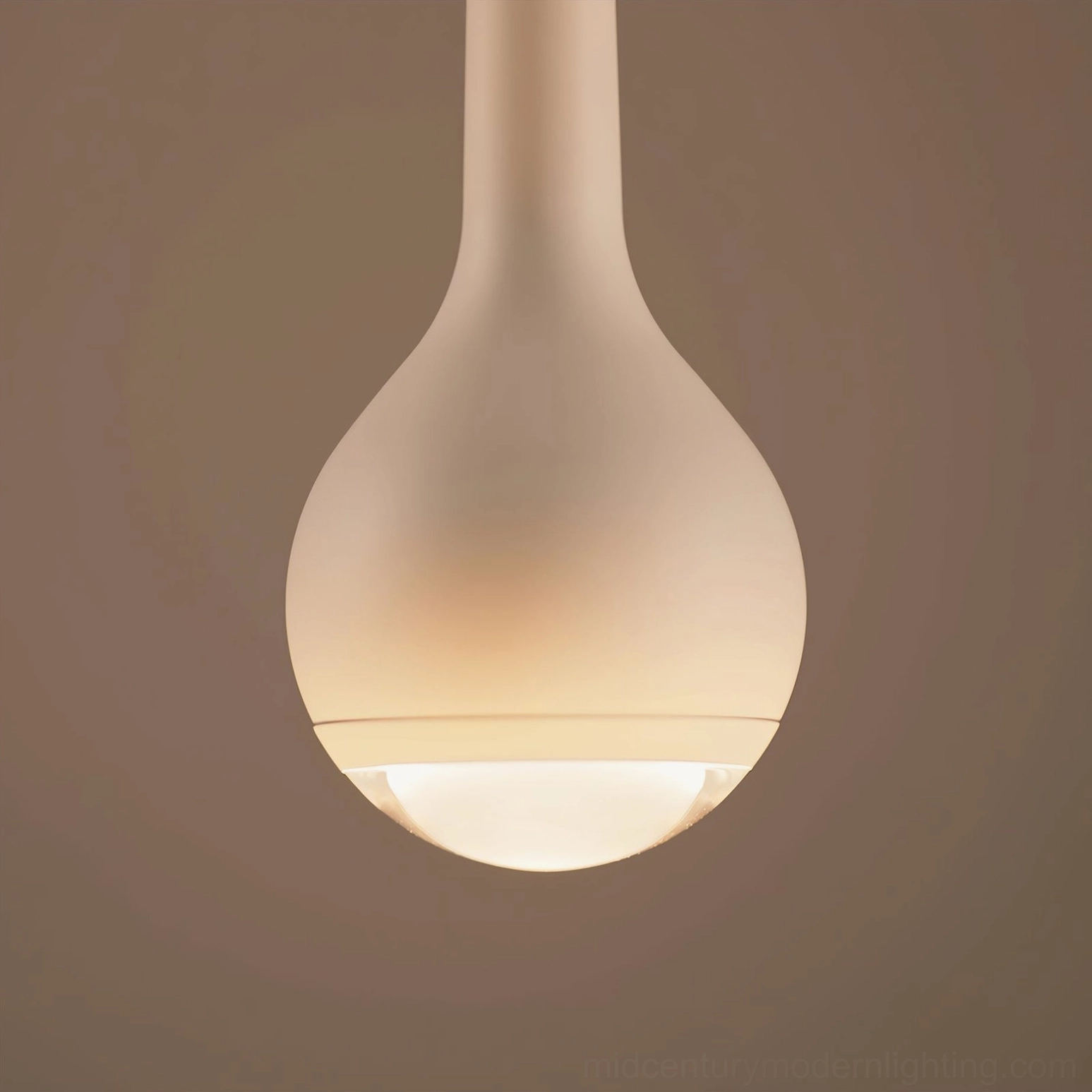 Multiple black pendant lights creating uniform lighting in open-plan office environment