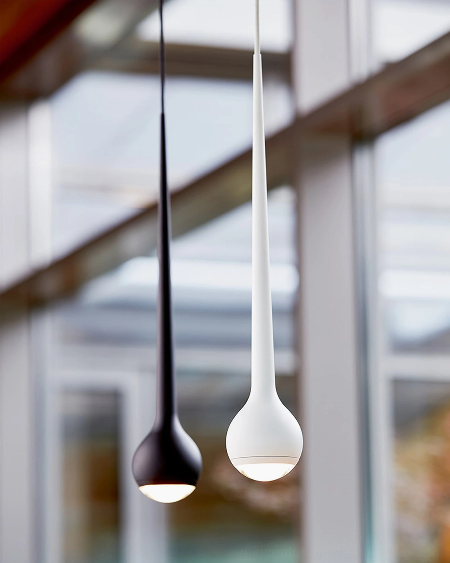 Three-head pendant cluster in chrome finish for contemporary commercial dining area