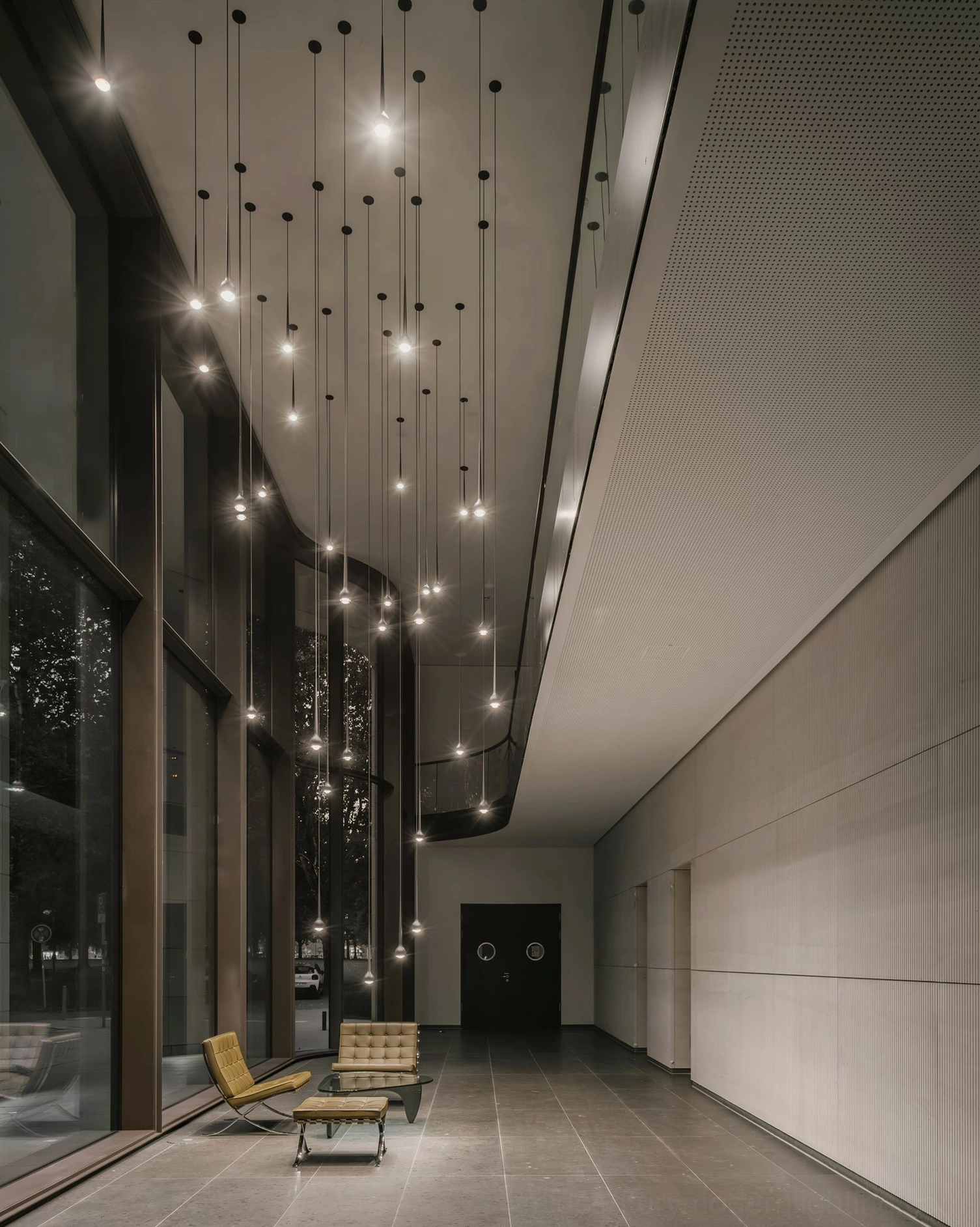 Falling Water pendant light fixtures in chrome finish with warm downlighting detail