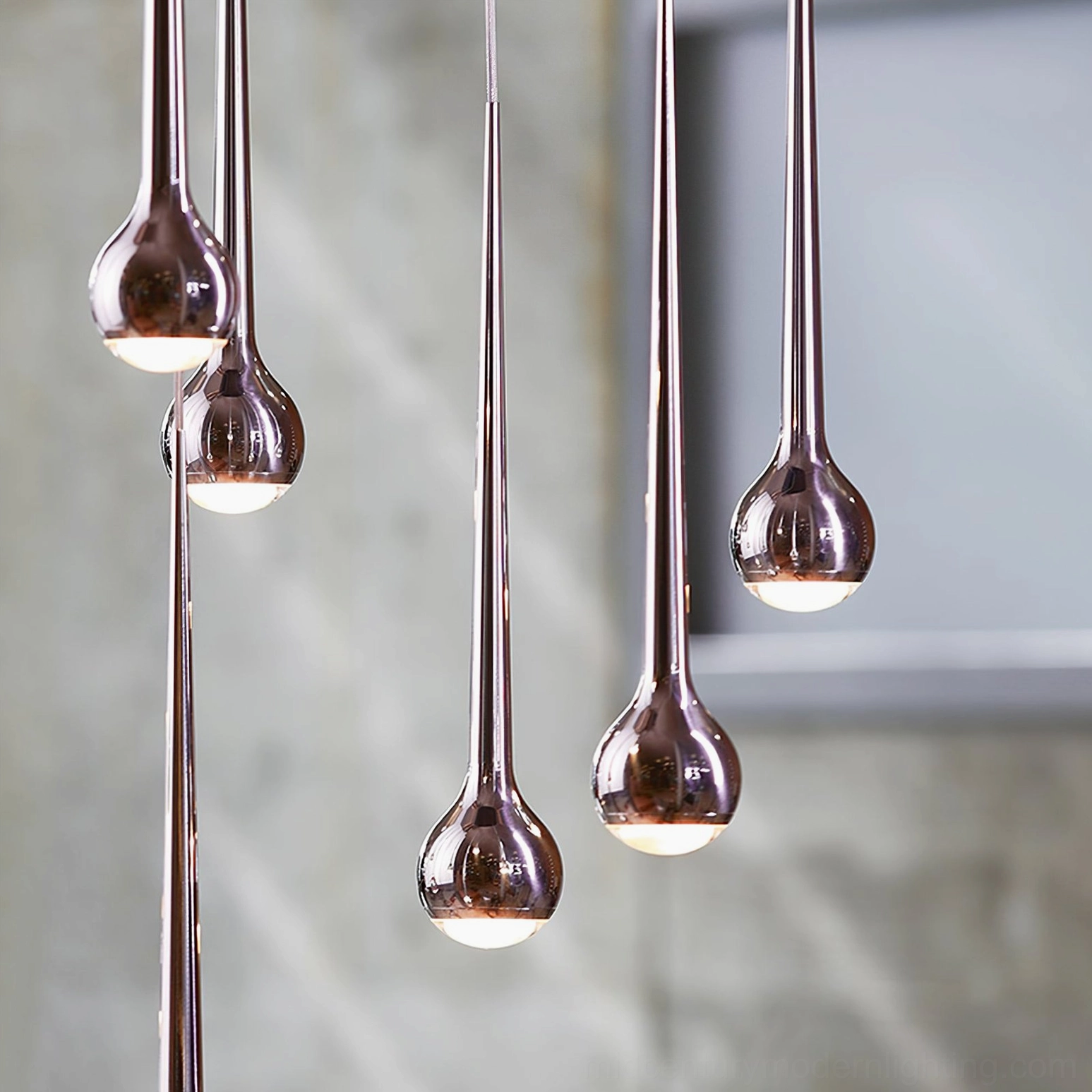 Five-head teardrop pendant cluster installation in large commercial modern space