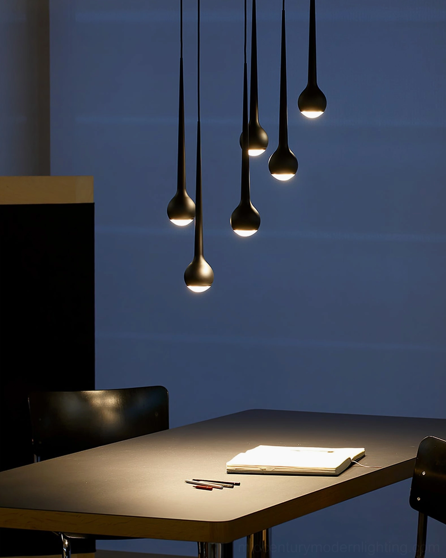 White teardrop pendant lamp cluster installation in modern residential setting