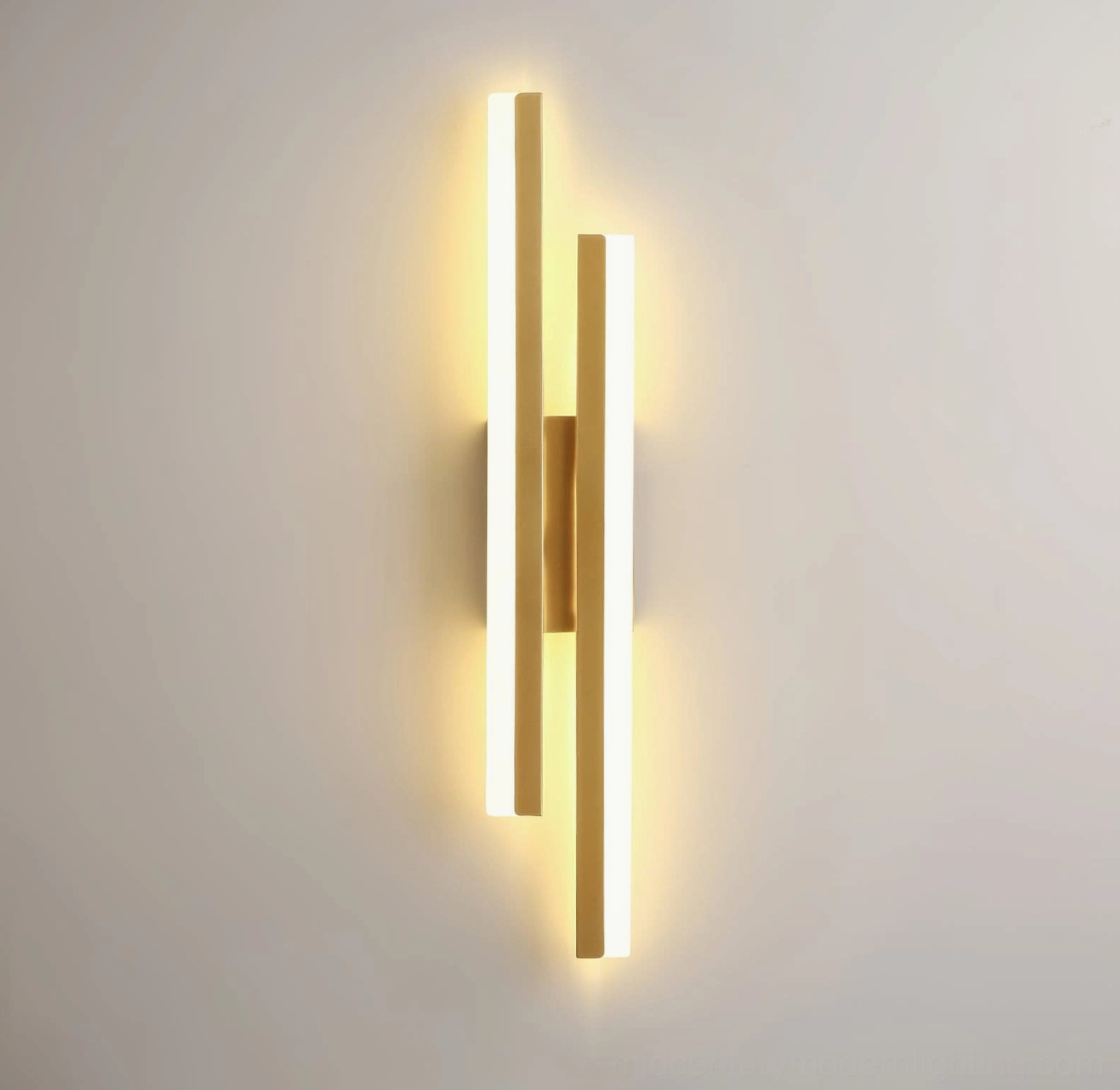Gold Fallon geometric wall sconce featuring symmetrical tube design and warm illumination