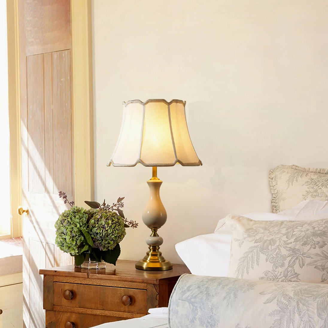Mid-century modern table lamp in master bedroom corner with green floral decor and upholstered bed