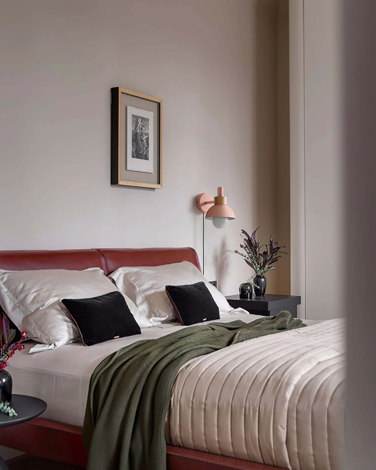 Fanta pink plug-in sconce in master bedroom with red bed frame and neutral decor