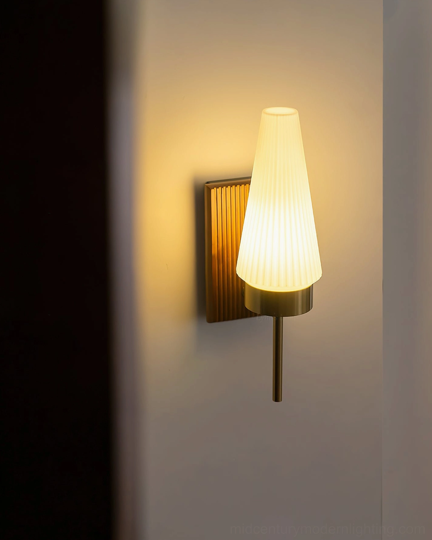 Farrell wall lamp unlit centered view with ribbed glass shade and vertically textured wood backplate