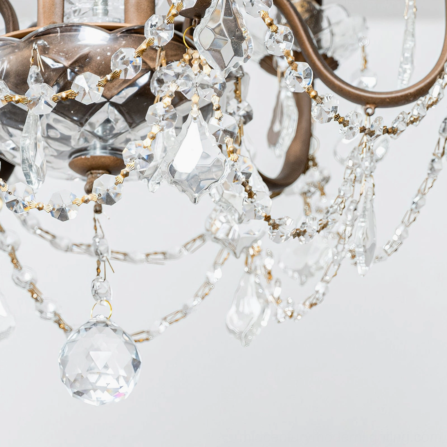 Fauna crystal chandelier mounted on decorative ceiling with ornate frame, demonstrating architectural integration and light distribution